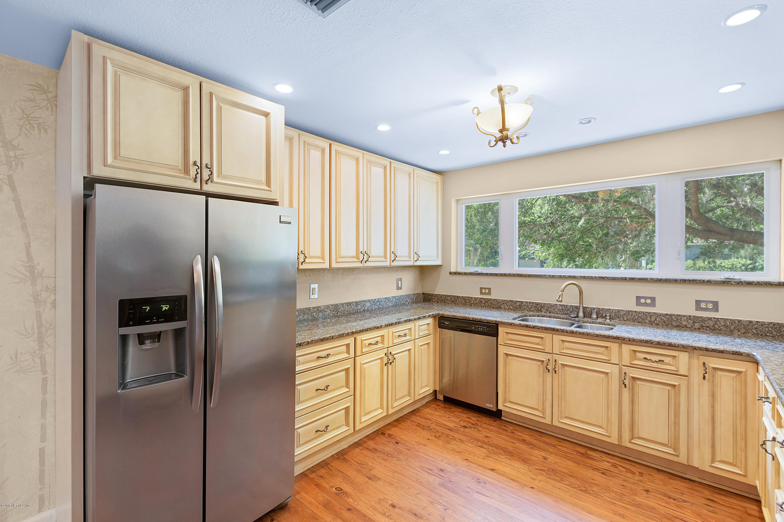 1725 Clemson Road Jacksonville, FL 32217 - Photo 8 of 43 a kitchen with stainless steel appliances granite countertop a sink stove and refrigerator