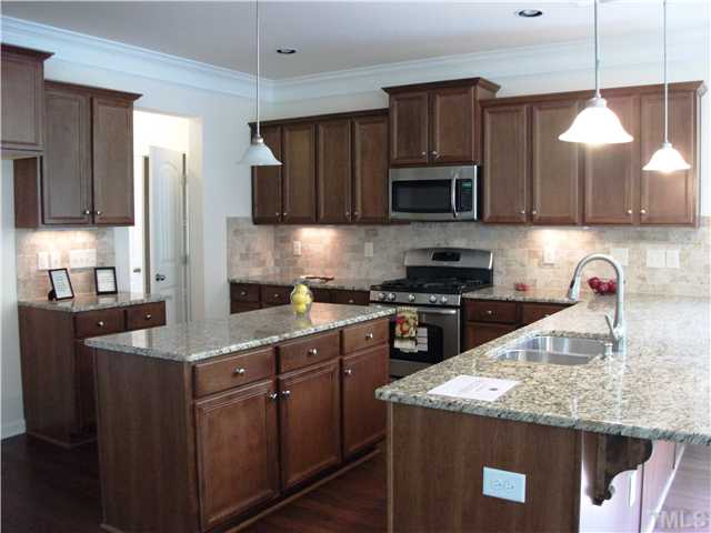 3608 Greenville Loop Road Wake Forest, NC 27587 - Photo 3 of 21 Abundant Cabinet Space, Center Island Pendant Lighting and Gas Range