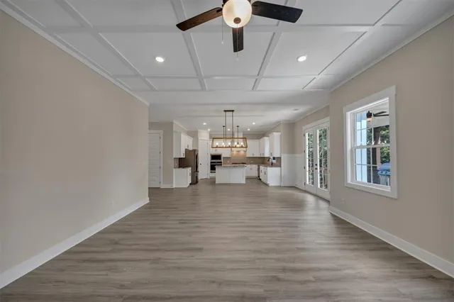 a view of livingroom with hardwood floor and a ceiling fan