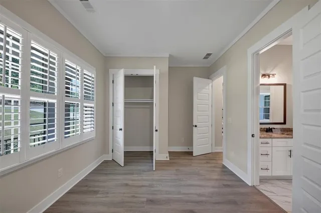 a view of a kitchen cabinets and wooden floor