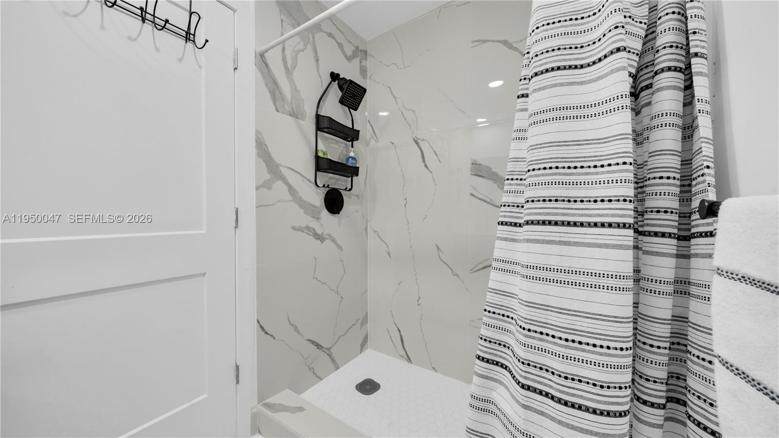 417 Northwest 13 Court Homestead, FL 33034 - Photo 12 of 49 a bathroom with a shower and a sink