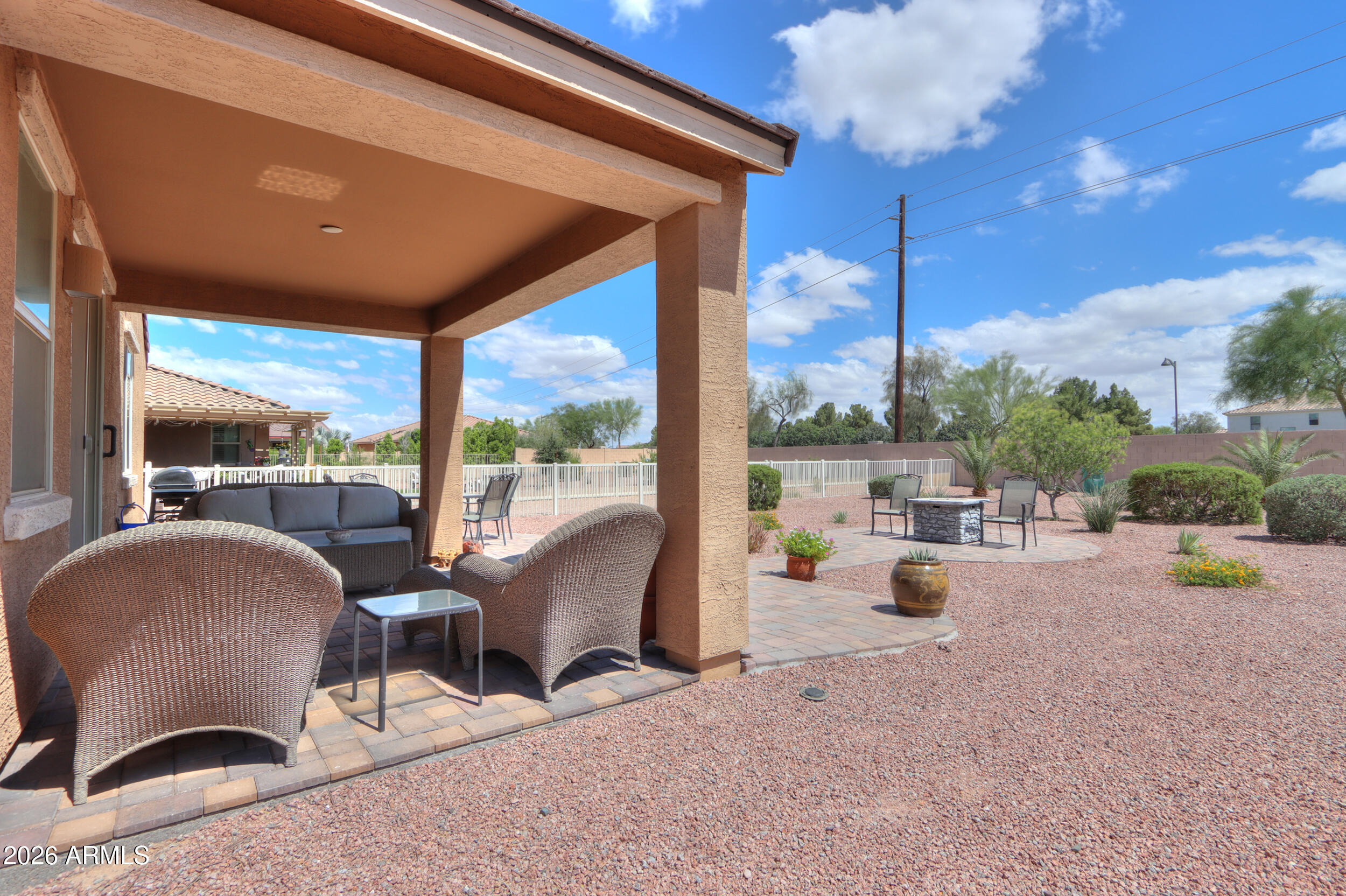 42085 West Cribbage Road Maricopa, AZ 85138 - Photo 35 of 35 a view of a terrace with furniture and a fire pit