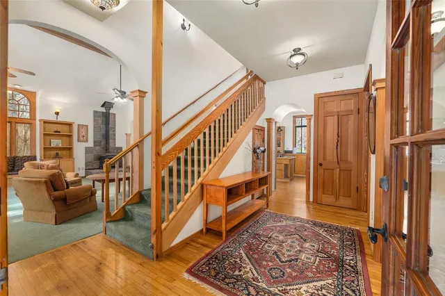 a large kitchen with stainless steel appliances a lot of counter space and a window