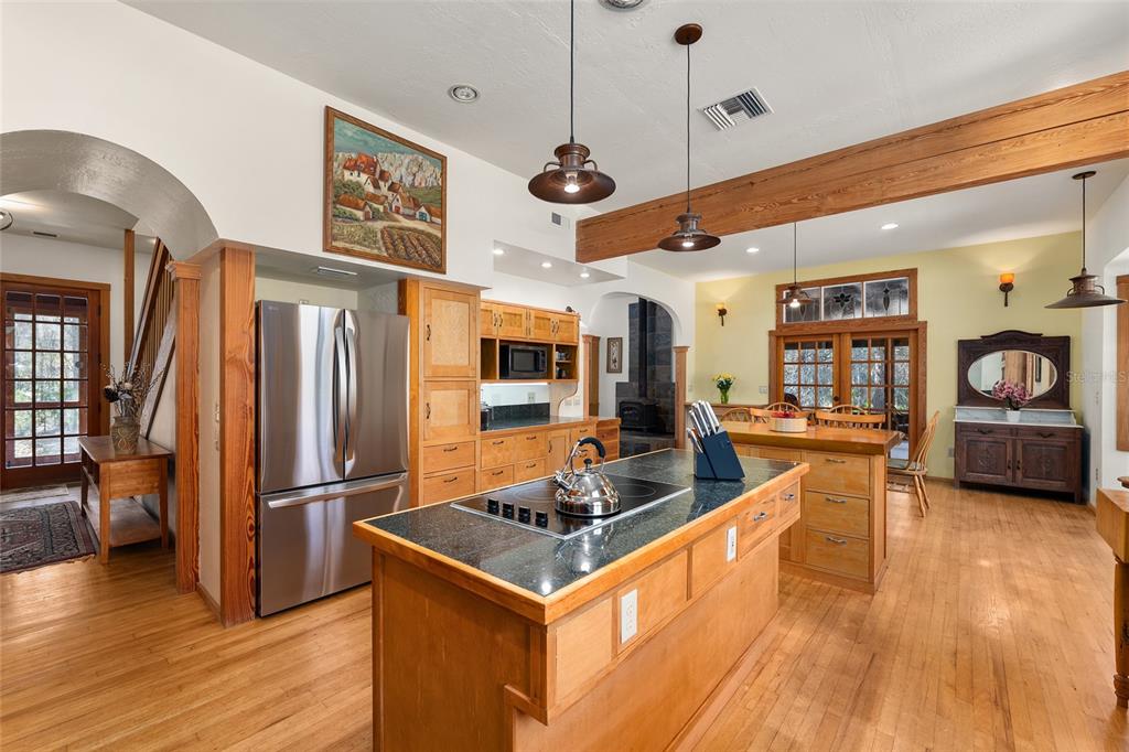 21736 Northwest 75th Avenue Road Micanopy, FL 32667 - Photo 33 of 88 a kitchen with stainless steel appliances granite countertop a stove and a refrigerator