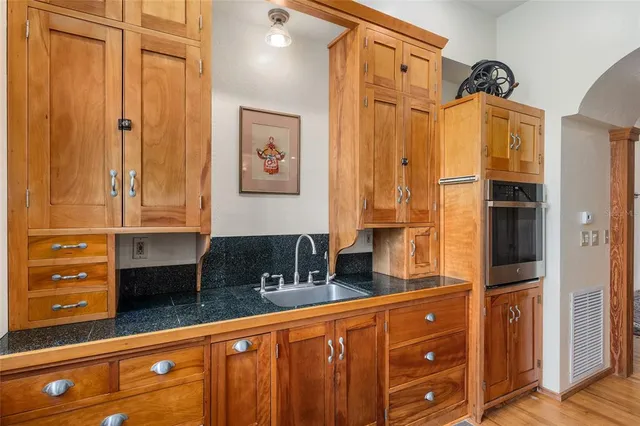 a view of a balcony with wooden fence and floor