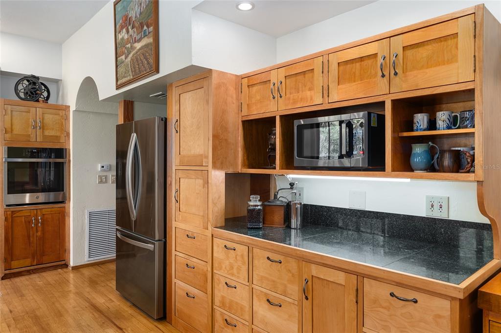 21736 Northwest 75th Avenue Road Micanopy, FL 32667 - Photo 36 of 88 a kitchen with stainless steel appliances granite countertop a refrigerator and a sink