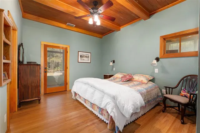 a view of a house with wooden floor and furniture