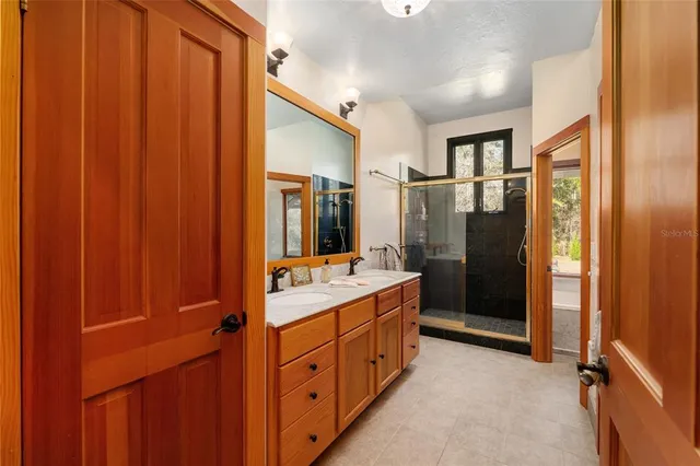 a view of a house with backyard and trees