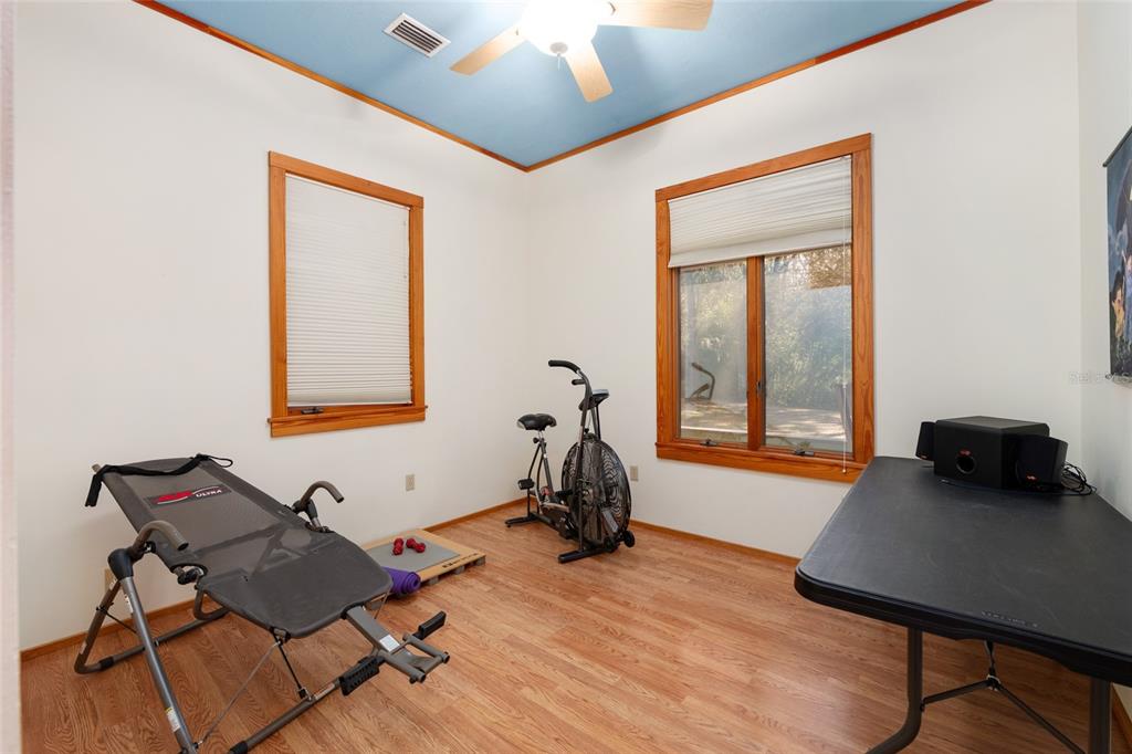 21736 Northwest 75th Avenue Road Micanopy, FL 32667 - Photo 48 of 88 a view of a workspace with furniture and a window