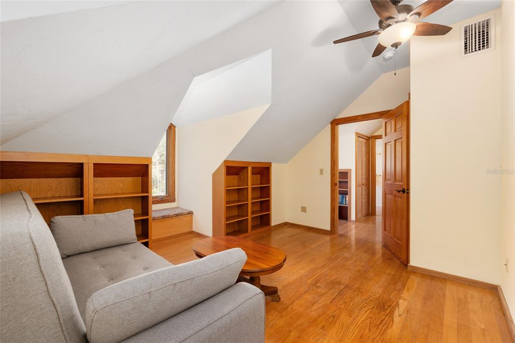 21736 Northwest 75th Avenue Road Micanopy, FL 32667 - Photo 56 of 88 a living room with furniture and a window