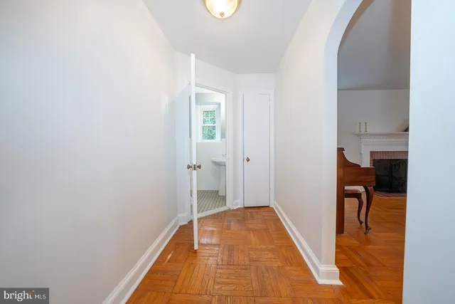 a view of a room with wooden floor