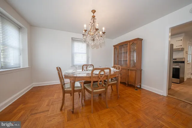 a view of a dining room with furniture and window