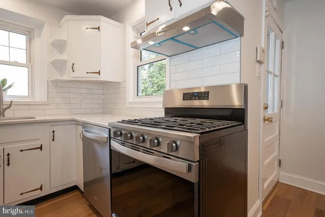 a kitchen with a stove and a sink