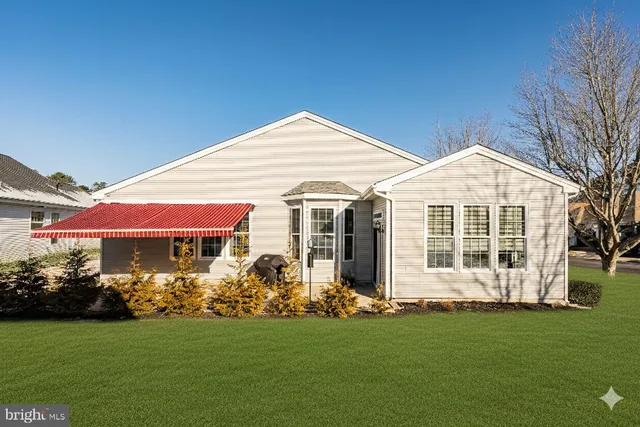 a sign that is sitting in front of flowers