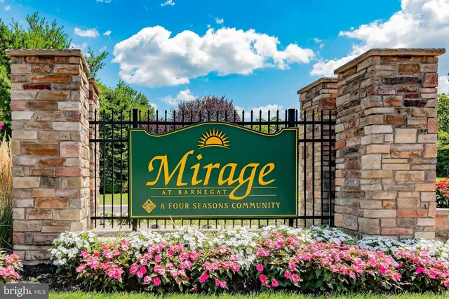 a room with pool table and windows
