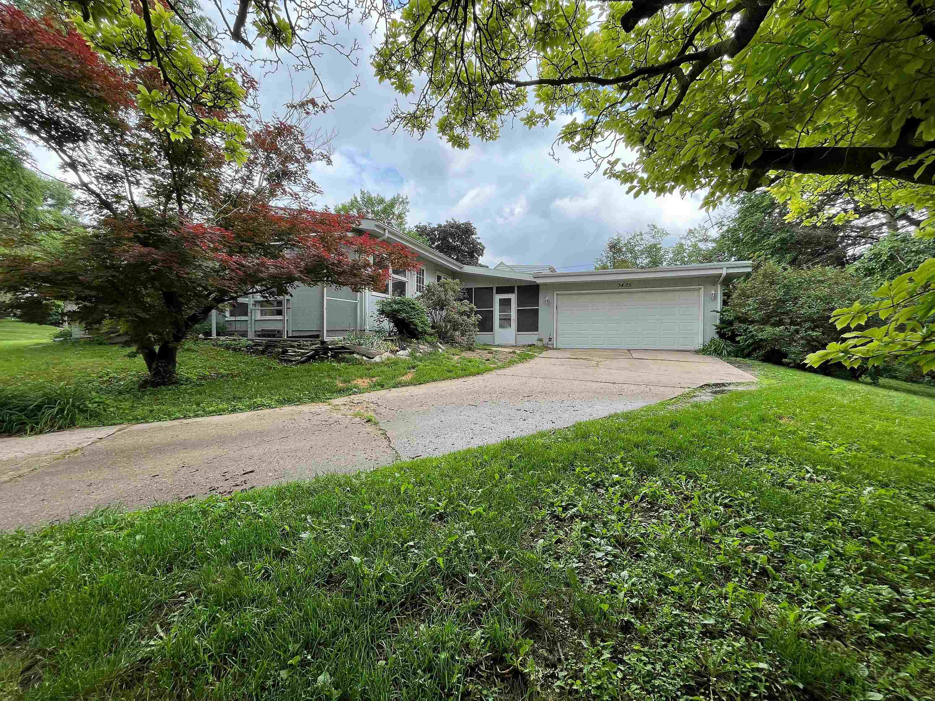 3405 North View Road Rockford, IL 61107 - Photo 32 of 33 a view of an house with backyard and a tree