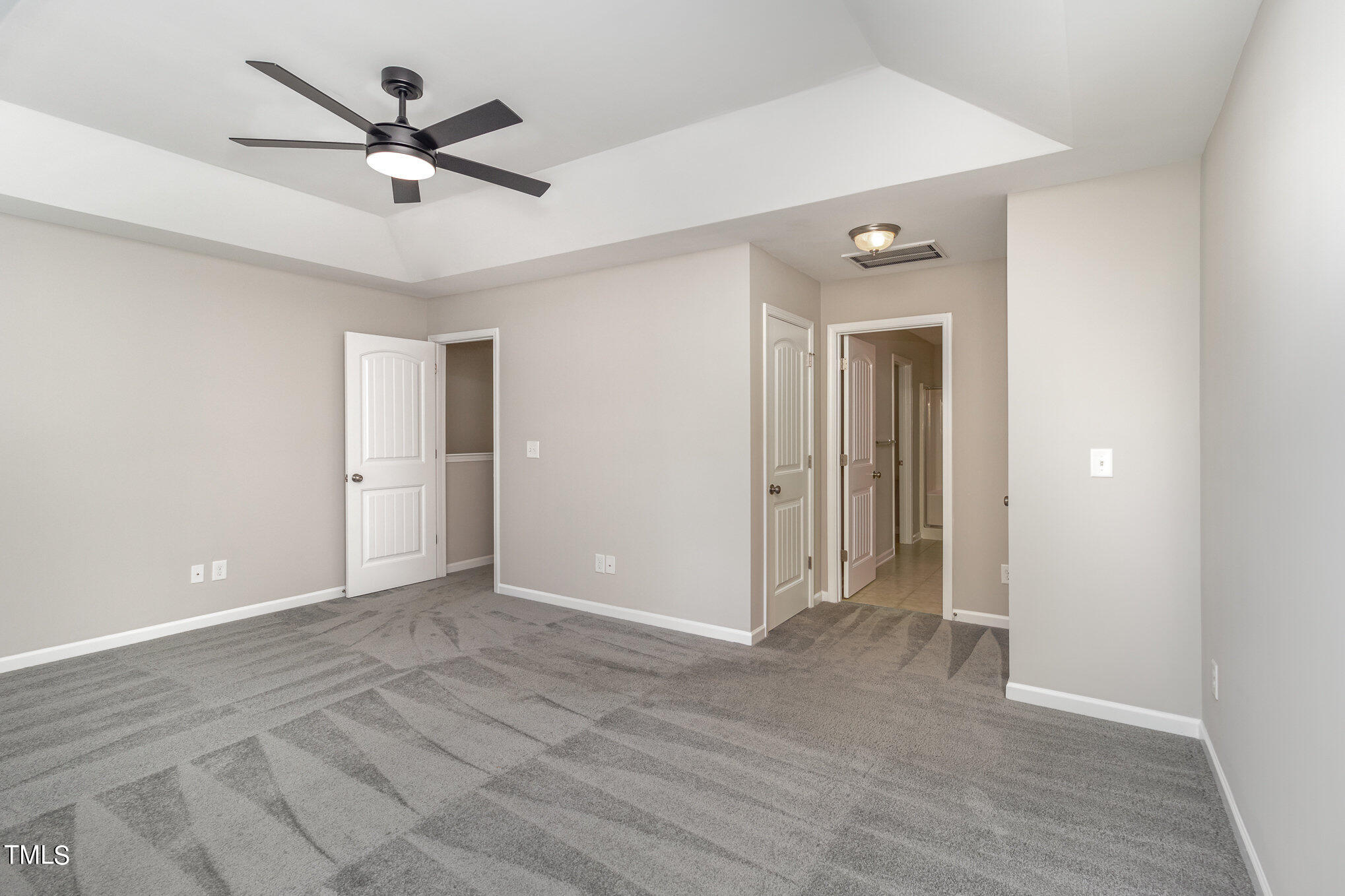 2418 Memory Ridge Drive Raleigh, NC 27606 - Photo 16 of 27 a view of a big room with wooden floor and a ceiling fan