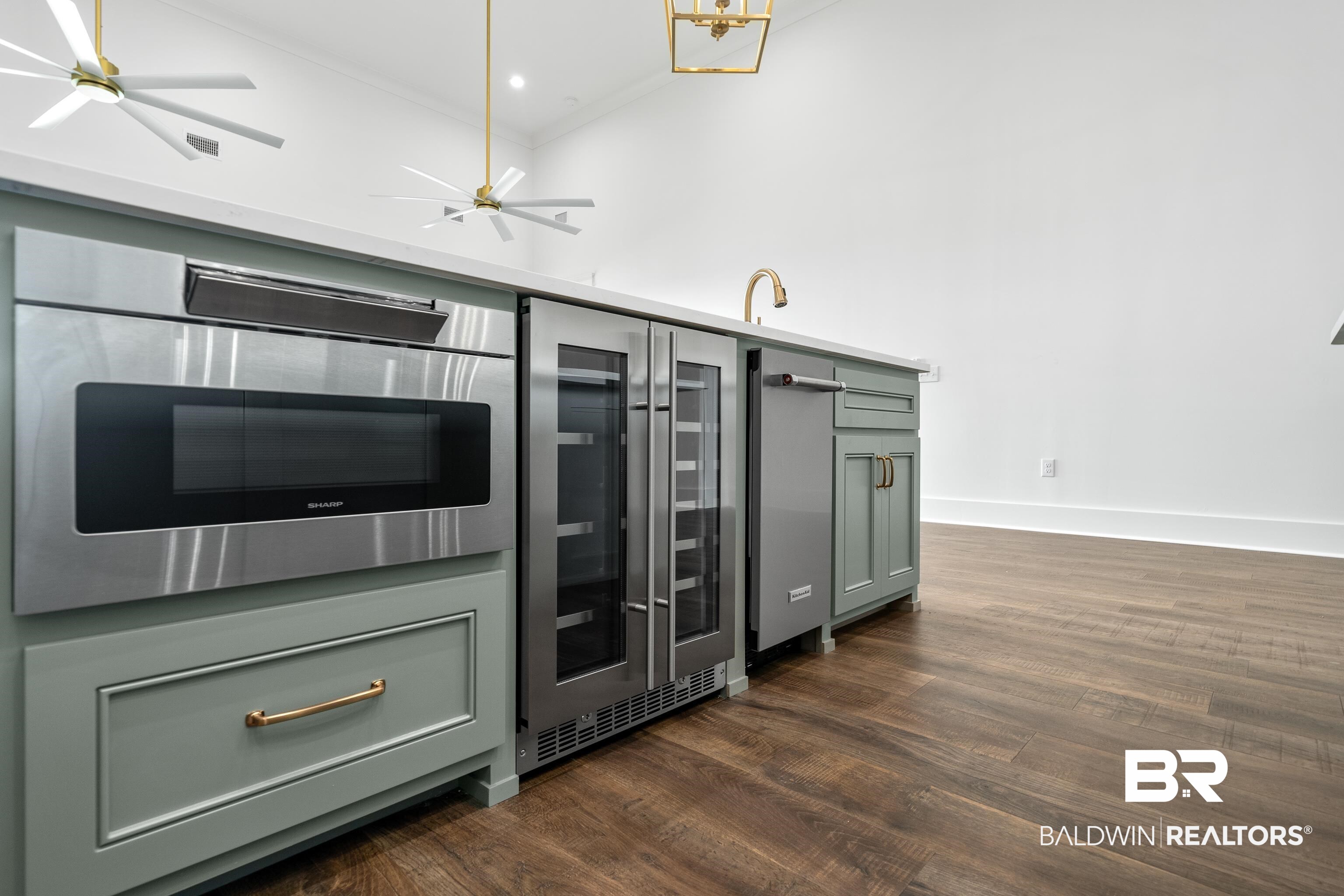 12453 County Road 1 Fairhope, AL 36532 - Photo 7 of 33 Kitchen featuring wine cooler, sink, dark wood-type flooring, and green cabinetry