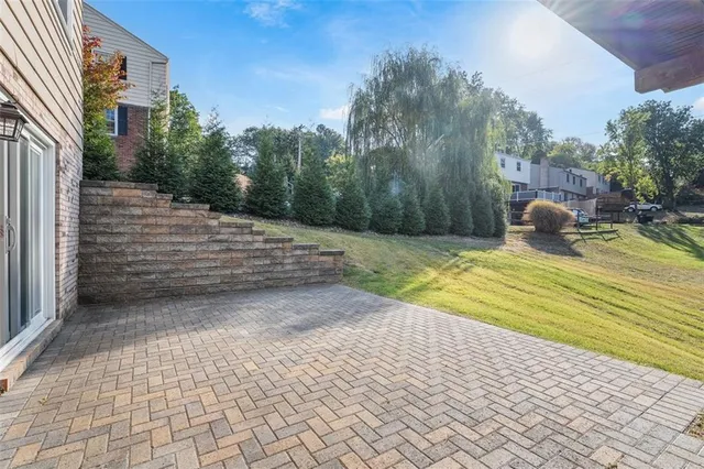 a view of yard with swimming pool and seating area