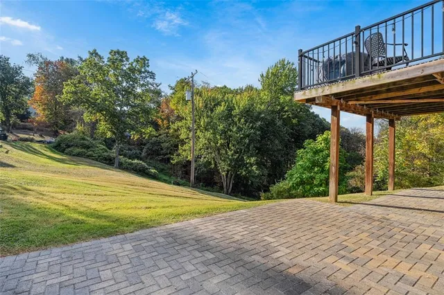 a view of a swimming pool with a patio