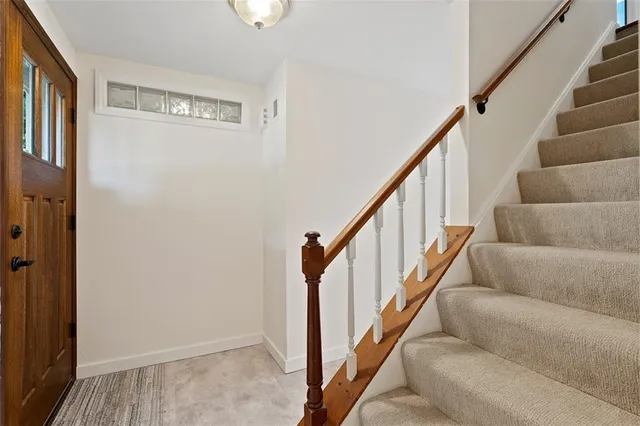 a view of staircase with wooden floor and stairs