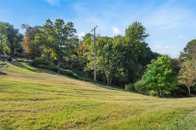 a view of a swimming pool with an outdoor space and seating area