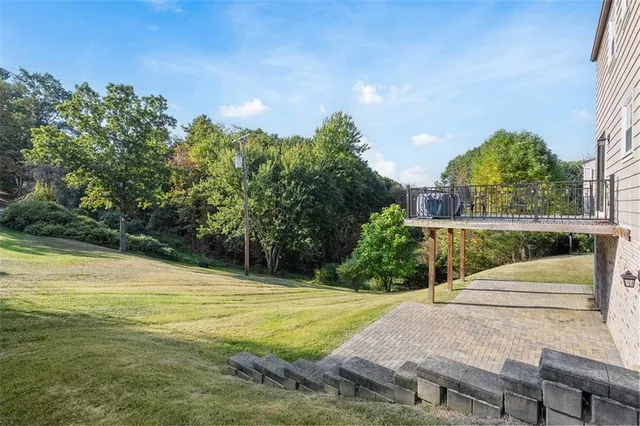 a view of a swimming pool with a patio