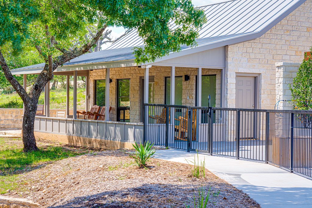 37 South Ranch Road 783 Harper, TX 78631 - Photo 15 of 19 a view of a house with a fence and a floor to ceiling window