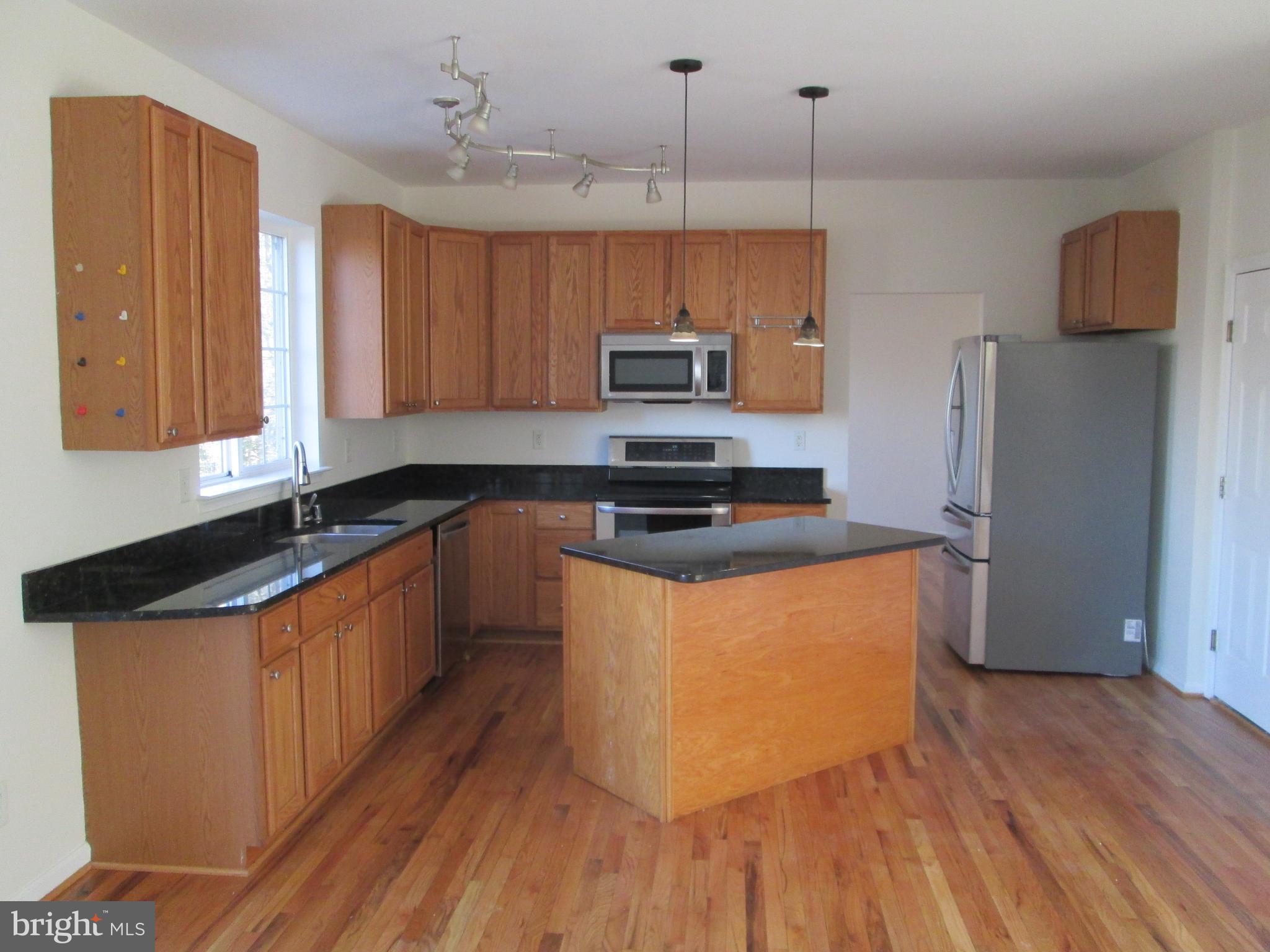 10 Waterford Road Pasadena, MD 21122 - Photo 6 of 57 Kitchen view 2 hardwood floor & granite tops