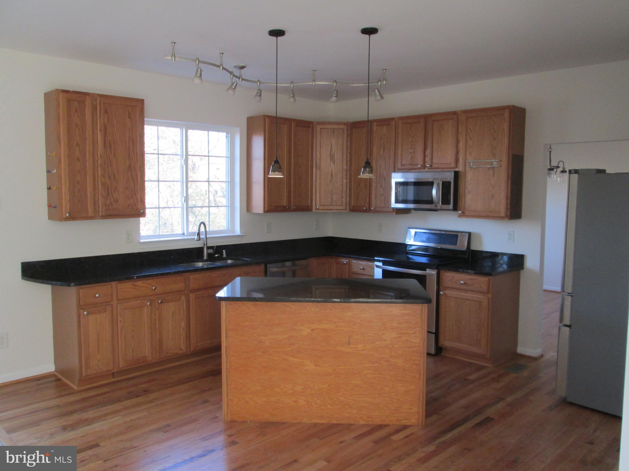 10 Waterford Road Pasadena, MD 21122 - Photo 7 of 57 Gorgeous Kitchen w/hardwood floor and granite tops
