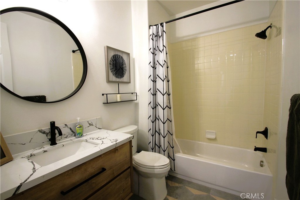5016 Corral Court Rancho Cucamonga, CA 91737 - Photo 41 of 70 a bathroom with a sink toilet and shower
