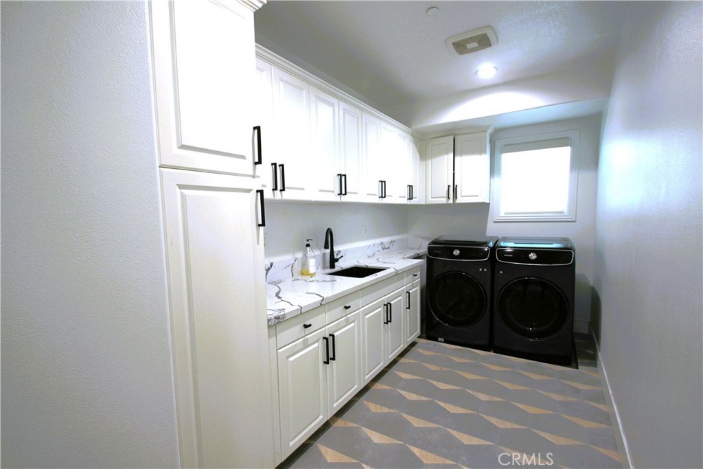 5016 Corral Court Rancho Cucamonga, CA 91737 - Photo 42 of 70 a kitchen with stainless steel appliances granite countertop a sink and a stove