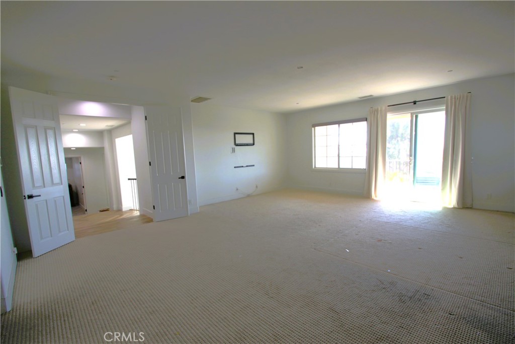 5016 Corral Court Rancho Cucamonga, CA 91737 - Photo 46 of 70 a view of empty room with windows