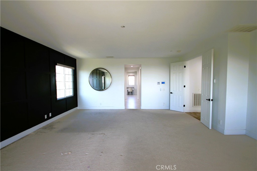 5016 Corral Court Rancho Cucamonga, CA 91737 - Photo 48 of 70 a view of a big room with windows and closet