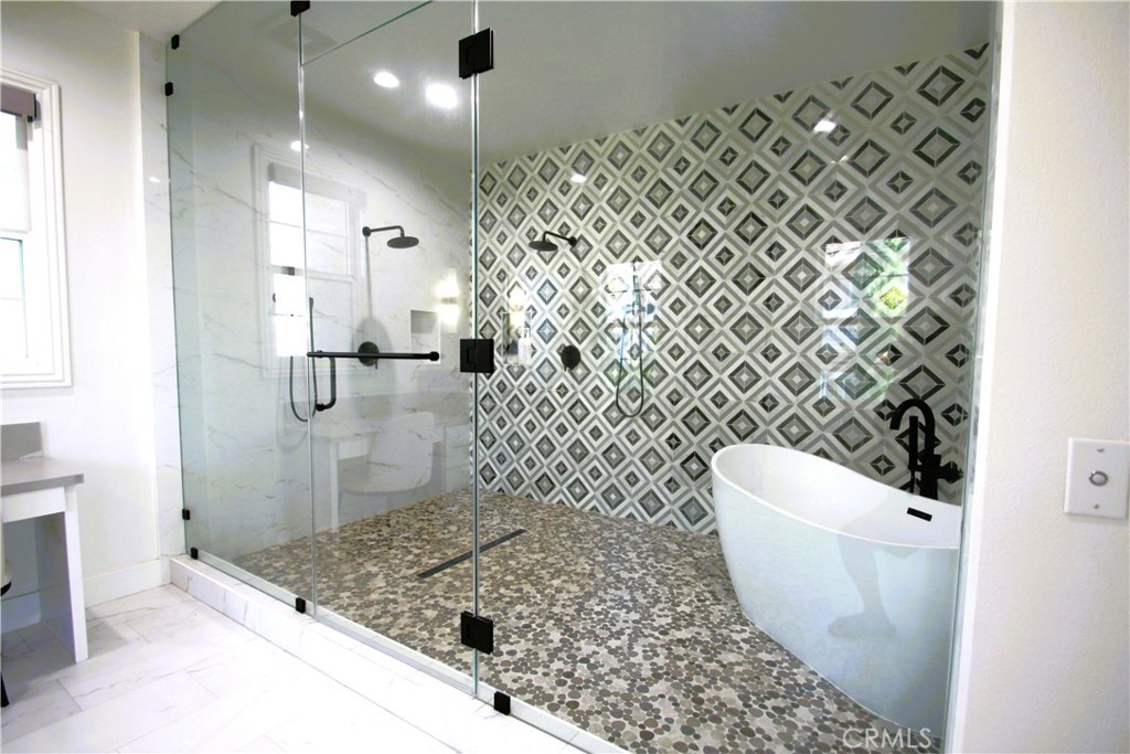 5016 Corral Court Rancho Cucamonga, CA 91737 - Photo 55 of 70 a bathroom with a sink toilet and shower