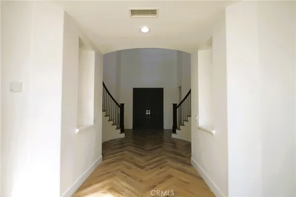 a view of a hallway with staircase