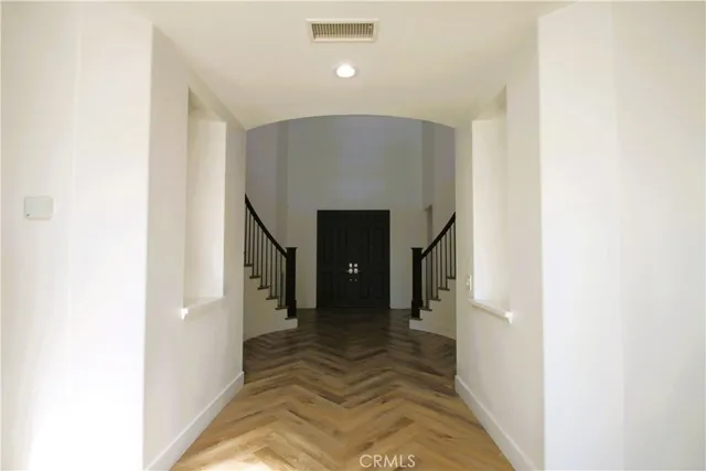 a view of a hallway with staircase