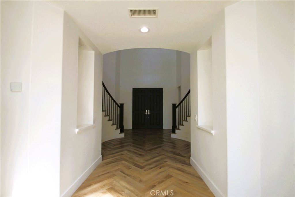 5016 Corral Court Rancho Cucamonga, CA 91737 - Photo 6 of 70 a view of a hallway with staircase