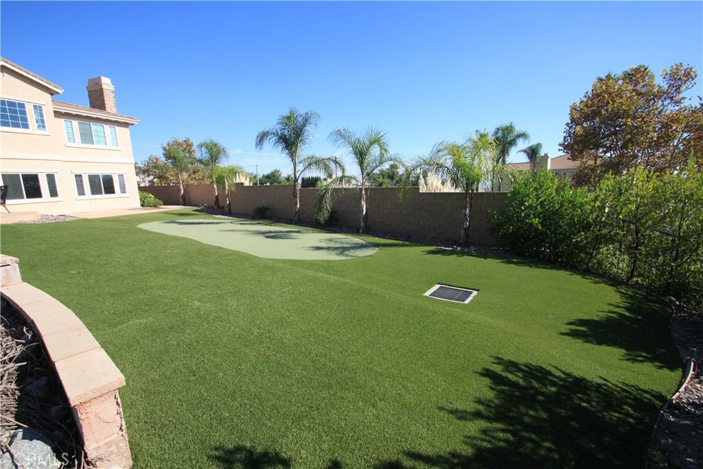5016 Corral Court Rancho Cucamonga, CA 91737 - Photo 63 of 70 a view of yard with swimming pool and green space