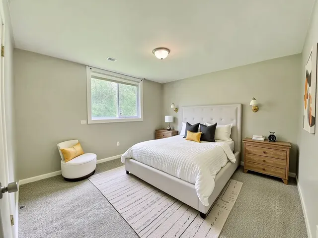 a bedroom with a bed and a couch