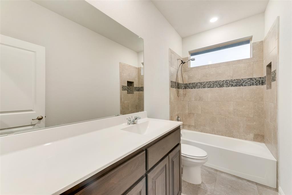 1419 Fox Hollow Road Krum, TX 76249 - Photo 18 of 29 Bathroom with vanity and bathing tub / shower combination