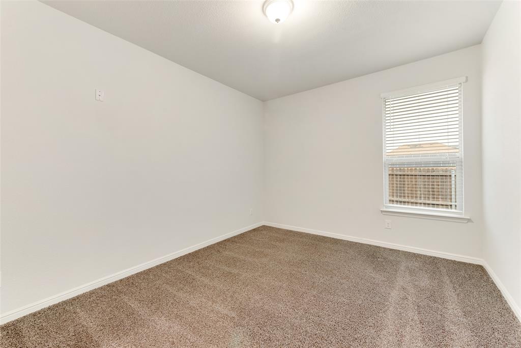 1419 Fox Hollow Road Krum, TX 76249 - Photo 19 of 29 Unfurnished room featuring carpet floors and baseboards