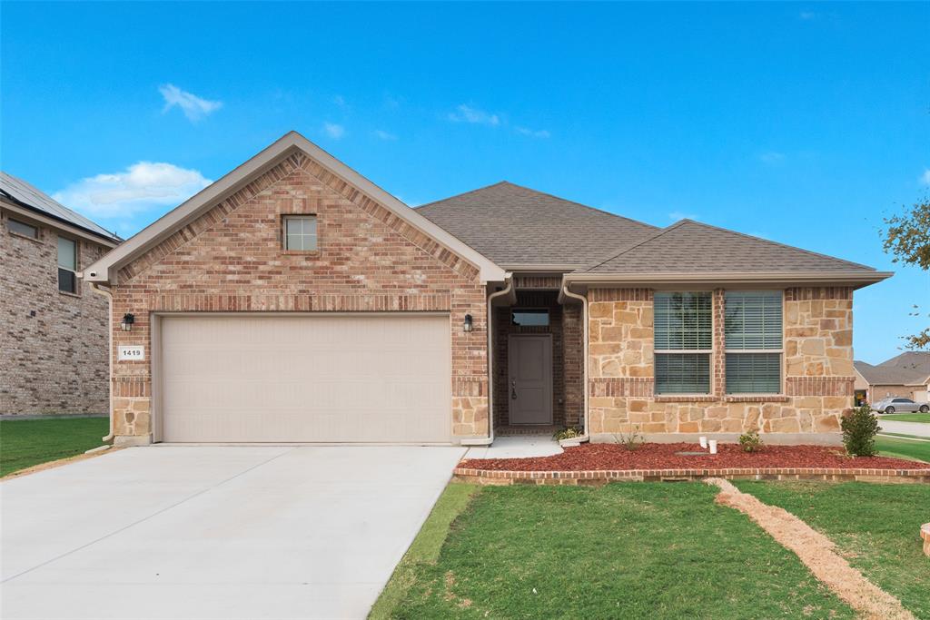 1419 Fox Hollow Road Krum, TX 76249 - Photo 2 of 29 View of front of home with roof with shingles, stone siding, concrete driveway, a garage, and a front yard