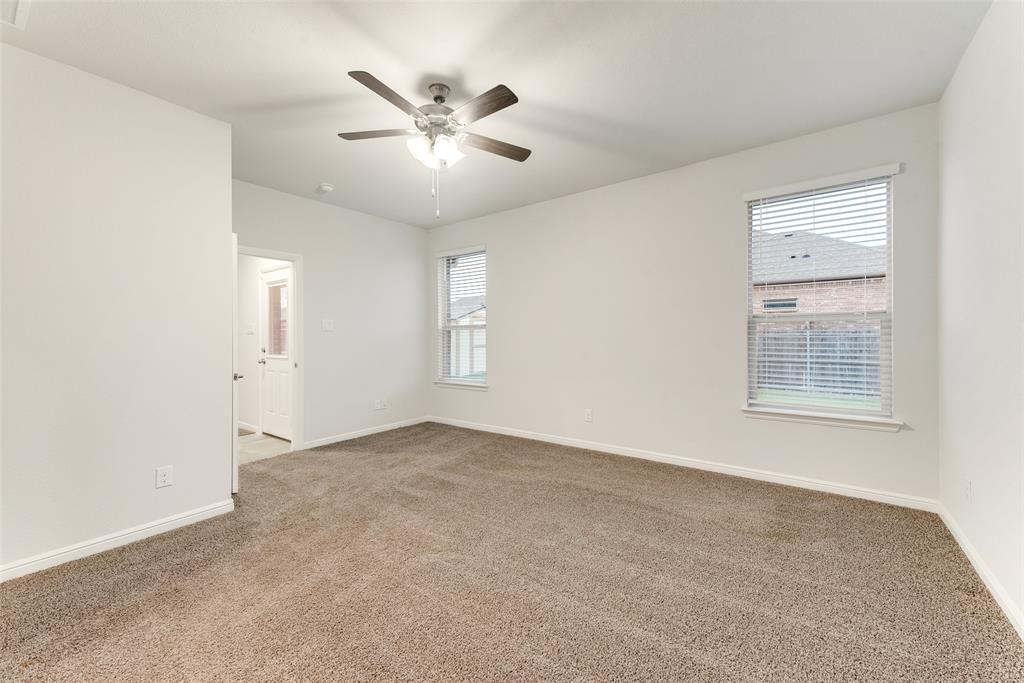 1419 Fox Hollow Road Krum, TX 76249 - Photo 22 of 29 Unfurnished room with light carpet and a ceiling fan