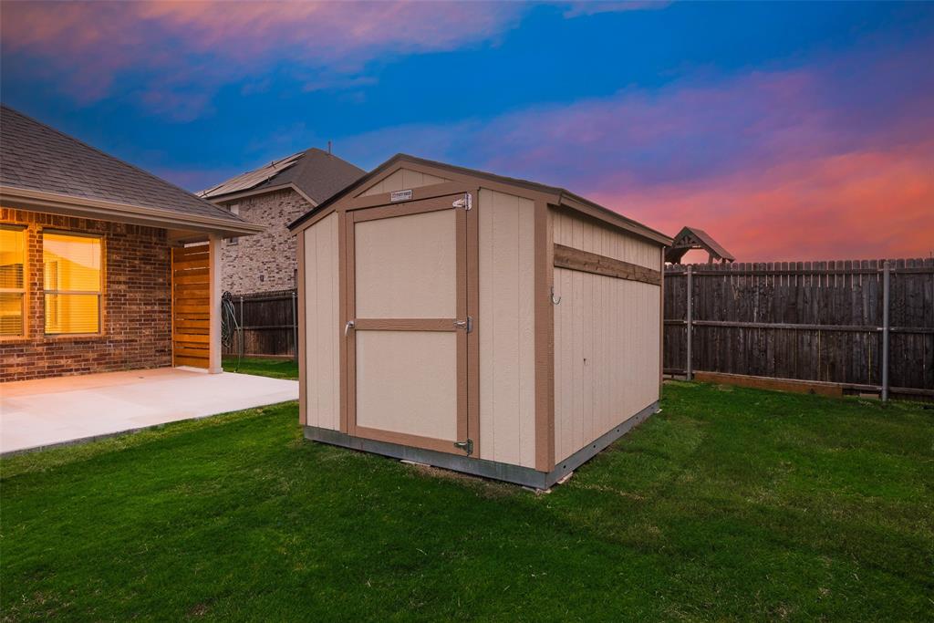 1419 Fox Hollow Road Krum, TX 76249 - Photo 29 of 29 View of shed with a fenced backyard