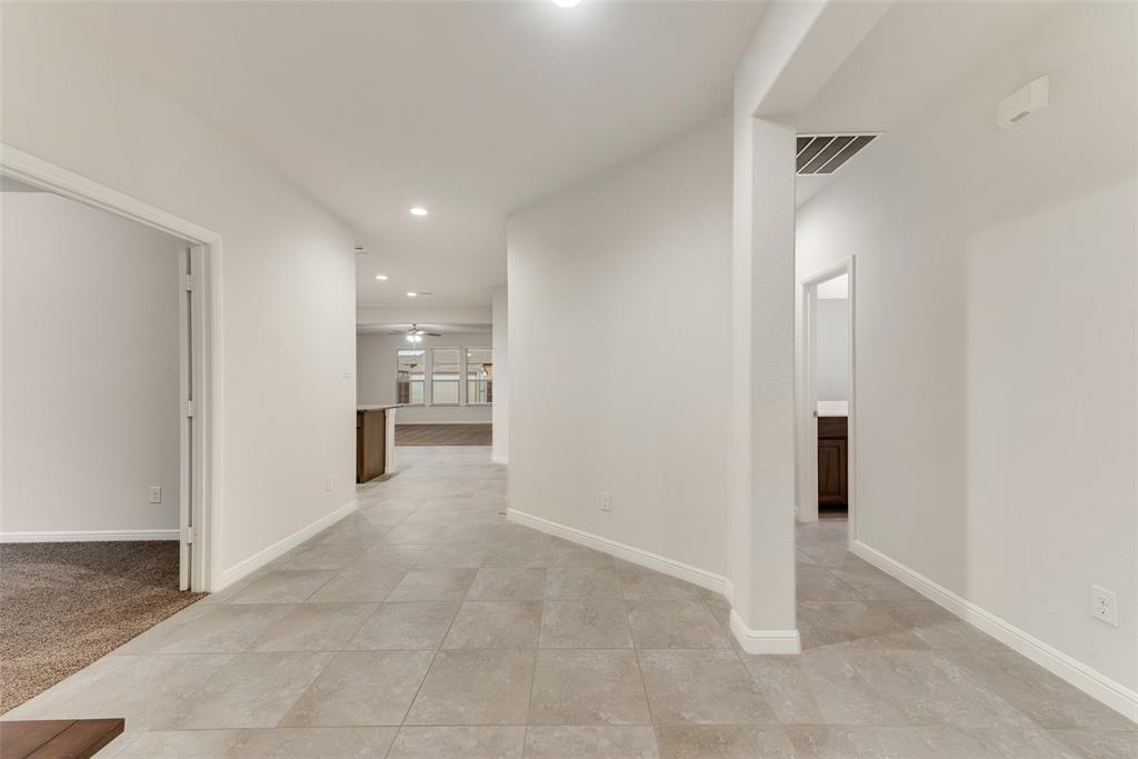1419 Fox Hollow Road Krum, TX 76249 - Photo 4 of 29 Hallway featuring recessed lighting and light tile patterned flooring