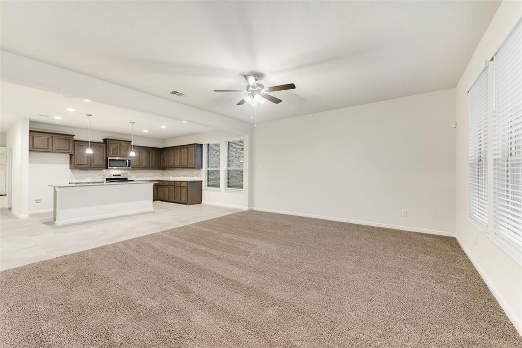 1419 Fox Hollow Road Krum, TX 76249 - Photo 7 of 29 Unfurnished living room featuring light carpet, recessed lighting, and ceiling fan