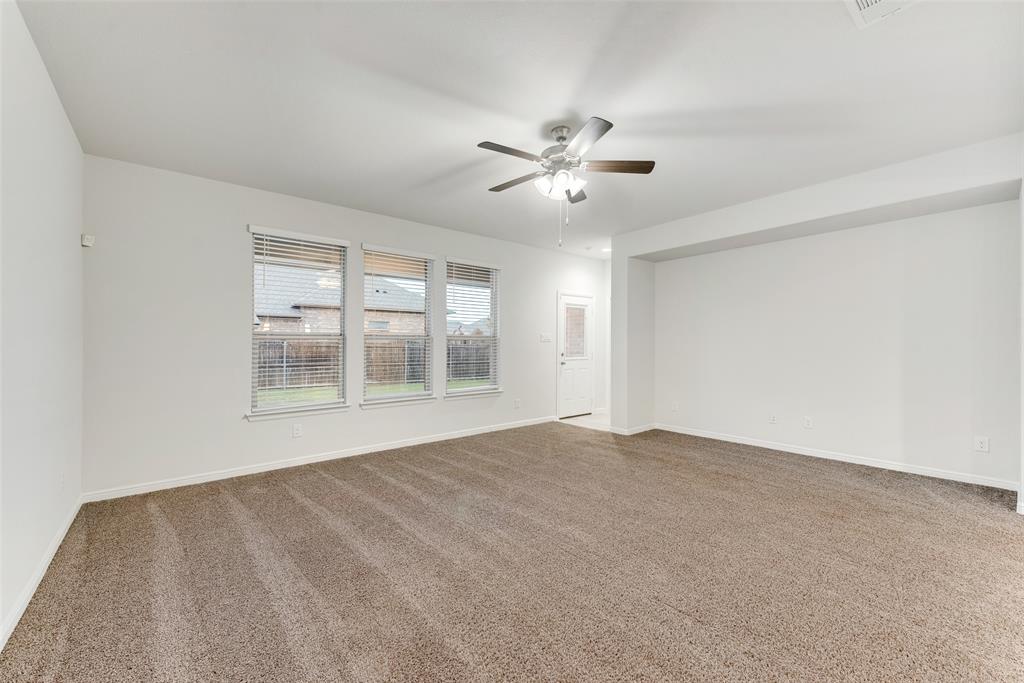 1419 Fox Hollow Road Krum, TX 76249 - Photo 8 of 29 Unfurnished room featuring light carpet and a ceiling fan