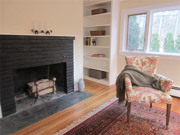 221 Lincoln Road Lincoln, MA 01773 - Photo 14 of 17 a living room with furniture and a fireplace