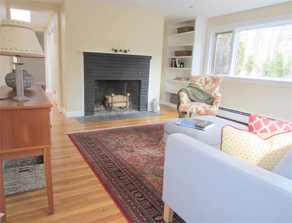 221 Lincoln Road Lincoln, MA 01773 - Photo 2 of 17 a living room with furniture and a fireplace